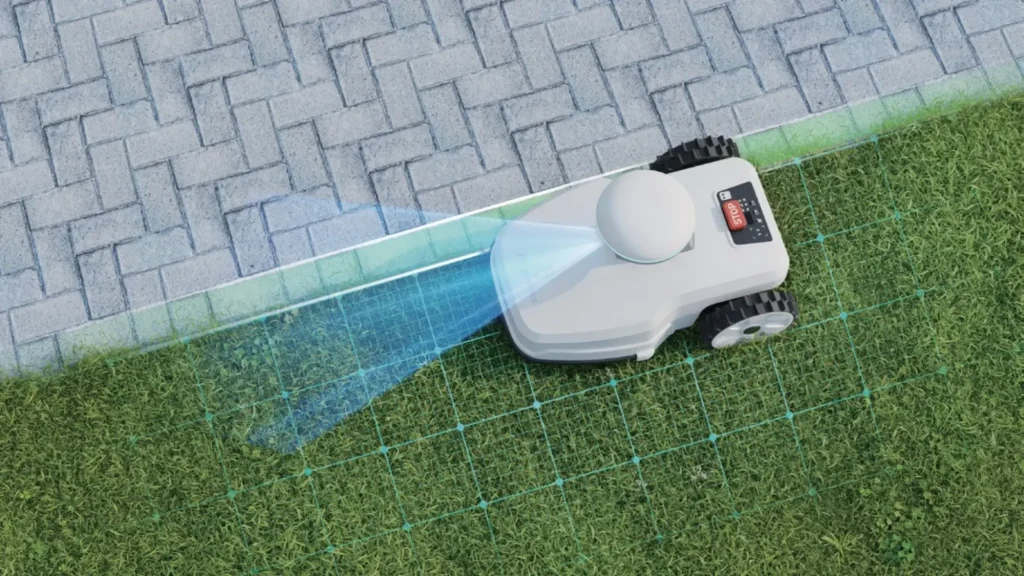 Robotic mower alongside a paved edge